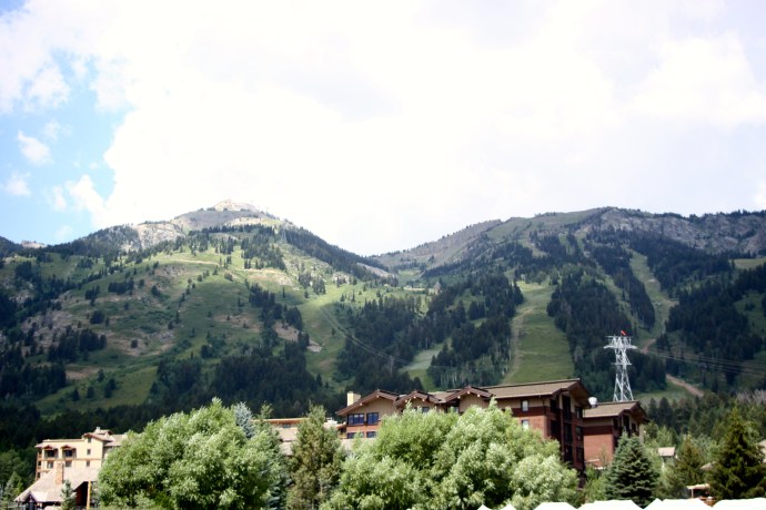That is our hotel nestled in between the mountain and grand trees